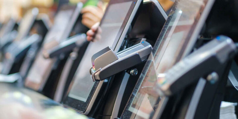 Row of restaurant point-of-sale payment terminals