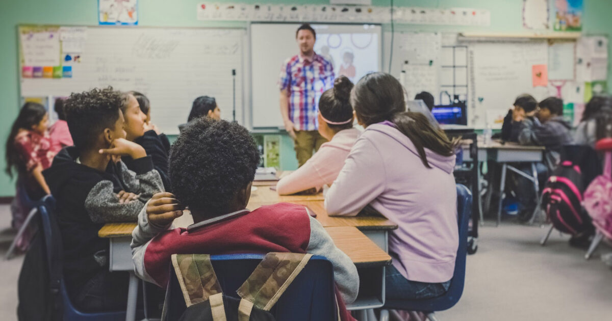 Teacher instructing students in a classroom
