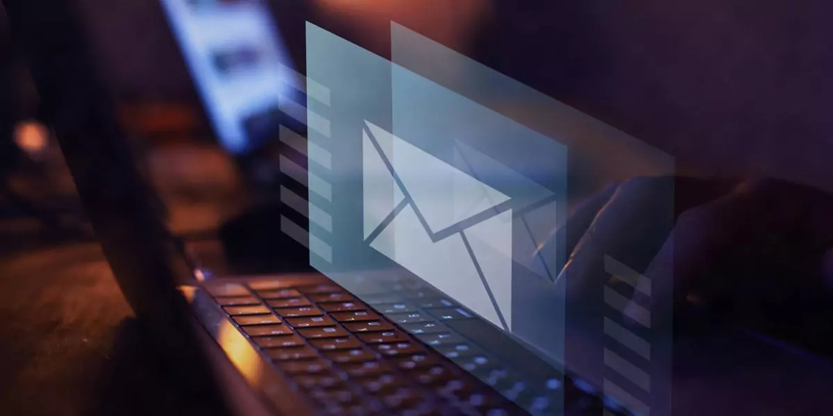 Laptop keyboard with a glowing email envelope icon overlay representing Amazon Pinpoint marketing